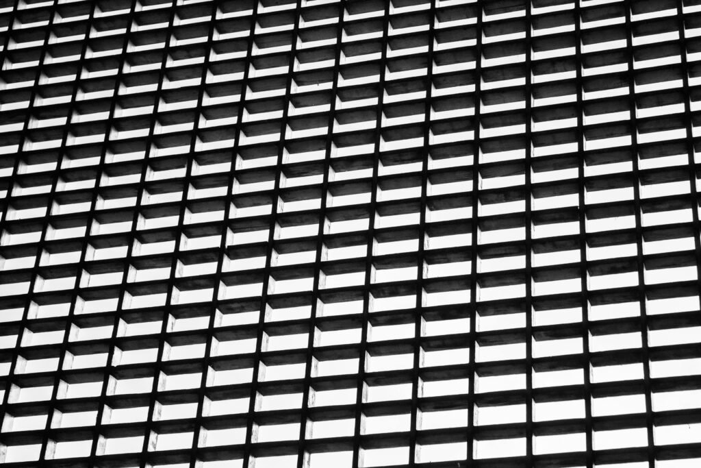 Geometric black and white grid pattern creating an abstract visual effect.